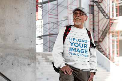 Crewneck Sweatshirt Mockup Featuring a Senior Man by a Construction Site