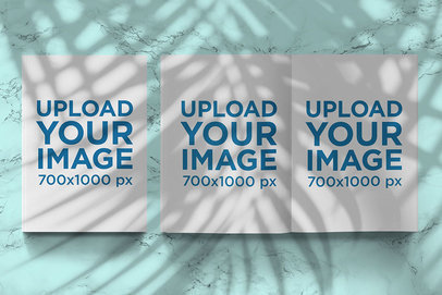 Mockup of Two Closed and Open Magazines Under a Shadow
