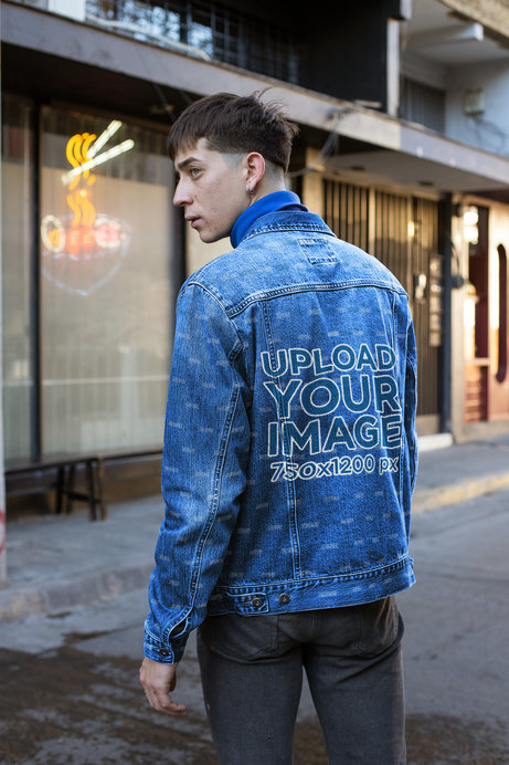 Mockup of a Man Wearing a Denim Jacket in the Street 