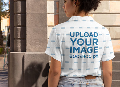 Back View Mockup Featuring a Woman Wearing a Button-Up Shirt in the City 