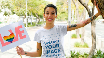 T-Shirt Video of a Woman Holding a Sign at the Pride Parade