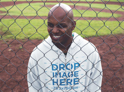 Zip Hoodie Mockup of a Black Guy at a Baseball Field a12452