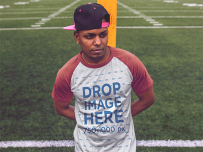 Raglan T-Shirt of a Man Wearing a Snapback Hat in a Field