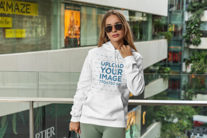 Hoodie Mockup Featuring a Woman at a Mall