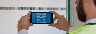 iPhone 6 Mockup in Landscape View Featuring an Architect