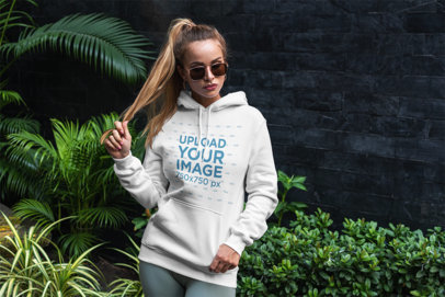 Hoodie Mockup Featuring a Woman with Long Hair Posing by Some Palm Leaves 3553-el1