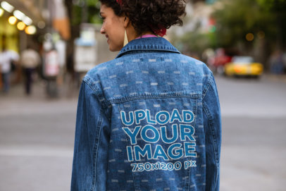 Back View of a Woman with a Denim Jacket Walking on the Street