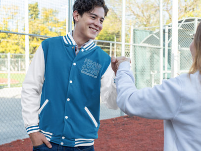 Varsity Jacket Mockup of a Man Fist-Bumping a Friend