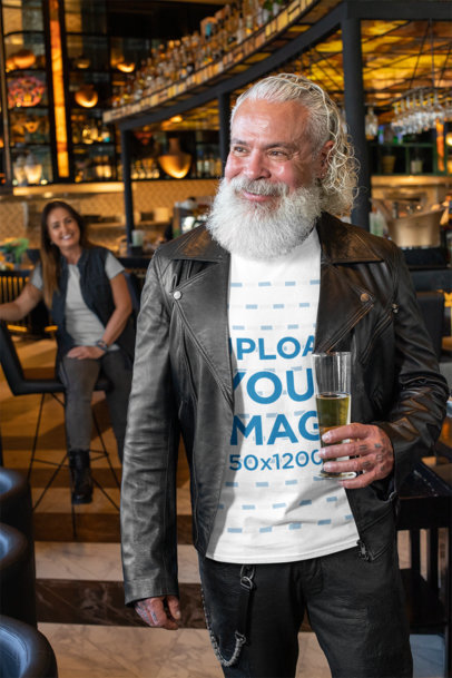 T-Shirt Mockup of a Smiling Senior Holding a Glass at a Bar