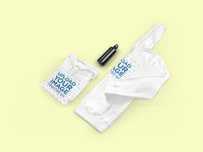 Mockup of Two Folded Hoodies on a Customizable Surface