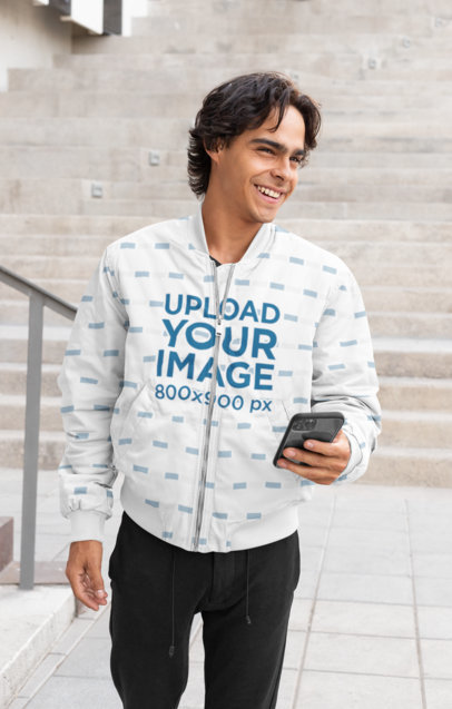 Bomber Jacket Mockup Featuring a Man with a Phone 