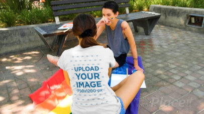 Back View T-Shirt Video Featuring a Woman Sitting on an LGBTQ Flag 