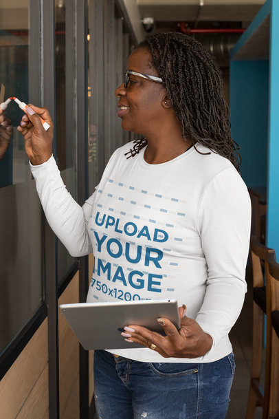 Long-Sleeve Tee Mockup Featuring a Middle-Aged Woman Writing on a Board 