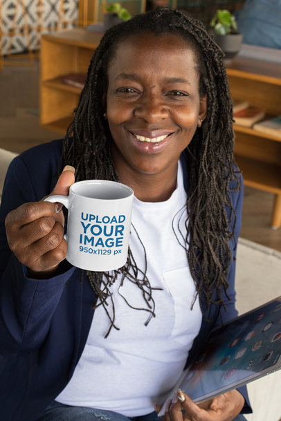 Mockup Featuring a Happy Woman Showing an 11 oz Mug to the Camera