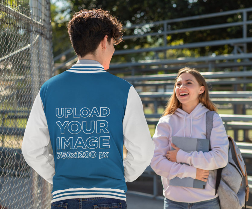 Varsity Jacket Mockup Featuring a Man Talking to a Friend