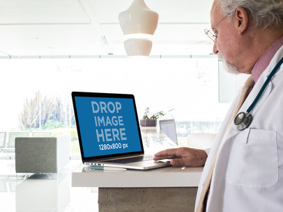 Mockup of a Senior Male Doctor with a MackBook at a Hospital
