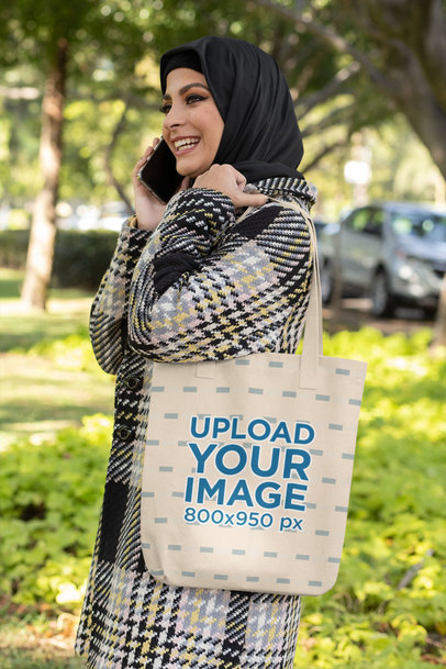Tote Bag Mockup of a Happy Woman Talking on the Phone
