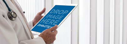 iPad Mockup of a Senior Doctor Holding his iPad Pro