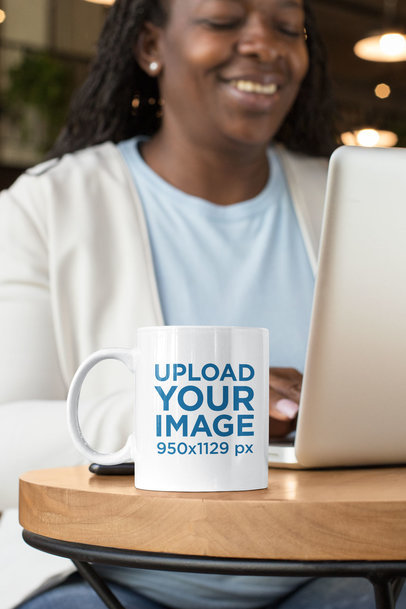 11 oz Mug Mockup Featuring a Happy Middle-Aged Woman Working 