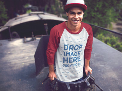 Raglan T-Shirt Mockup of a Young Man Peeking out of a Train