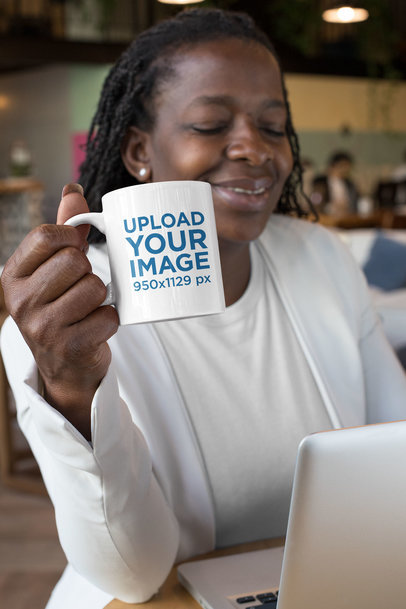 11 oz Mug Mockup Featuring a Woman Drinking Coffee at a Coworking Space 