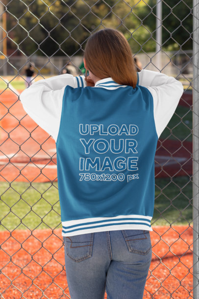 Mockup of a Young Woman with a Varsity Jacket Watching a Baseball Game 33208