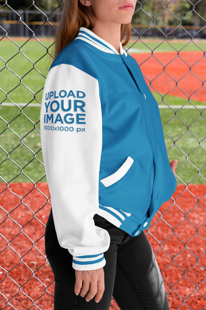 Varsity Jacket Mockup of a Woman Showcasing Her Sleeve 33212
