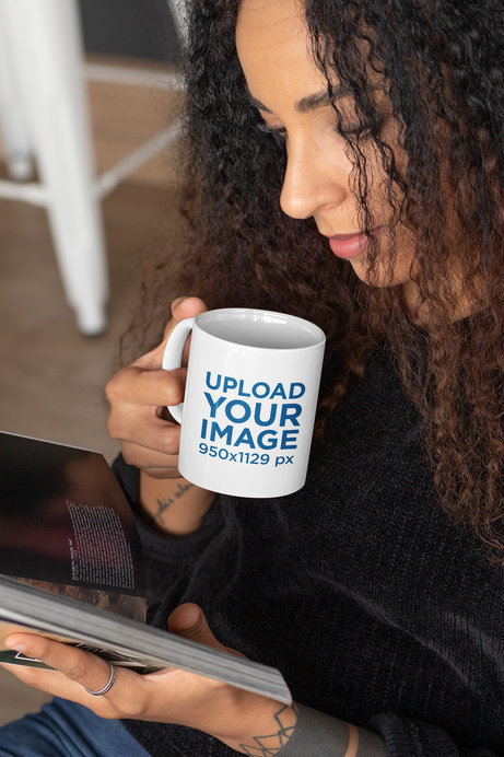 11 oz Mug Mockup Featuring a Woman Reading While Having a Coffee 