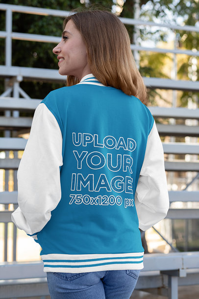 Back-View Mockup of a Woman Wearing a Varsity Jacket