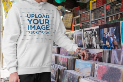 Pullover Hoodie Mockup Featuring a Man at a Records Shop