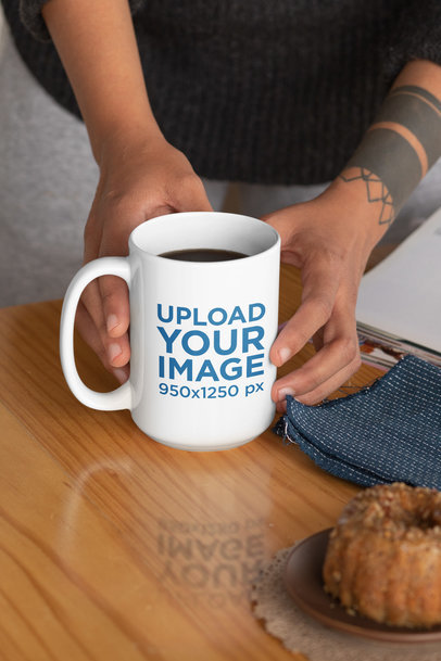 Mockup of a Tattooed Woman Holding a 15 oz Mug