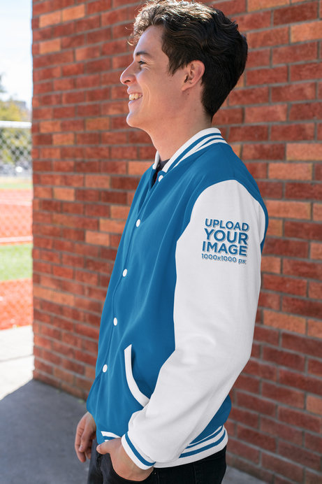 Sleeve Mockup of a Happy Young Man Wearing a Varsity Jacket 