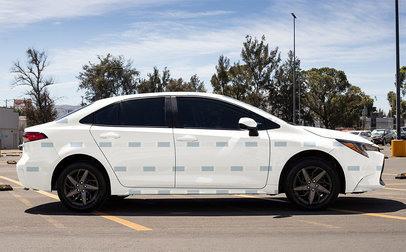 Side-View Mockup of a Car Decal Placed on a Sedan