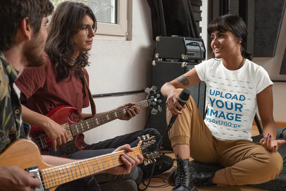 T-Shirt Mockup Featuring a Female Singer Practicing With Her Music Band 