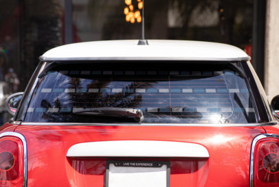 Mockup of a Rear Window Decal Placed on a Subcompact Car