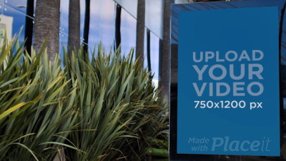 Video of a Mupi Next to Some Plants