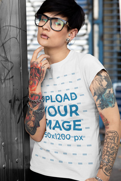 T-Shirt Mockup Featuring an Androgynous Person with Tattooed Arms