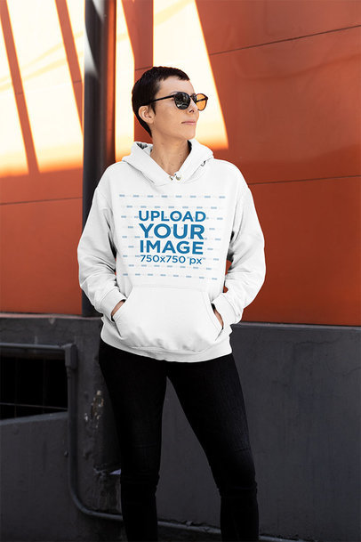 T-Shirt Mockup of an Androgynous Woman Wearing Sunglasses 