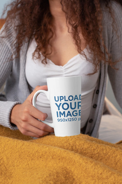 Mockup of a Woman Holding a 15 oz Conical Mug in Her Bedroom