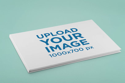 Mockup Featuring a Hard Cover Horizontal Book on a Flat Surface 33396