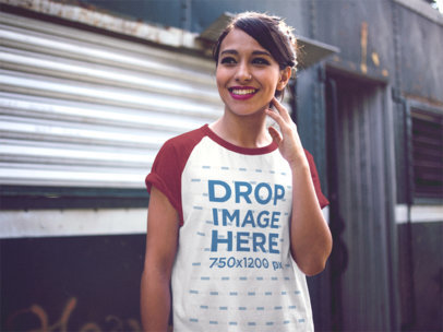 Raglan T-Shirt Mockup of a Young Smiling Woman Out in the Street
