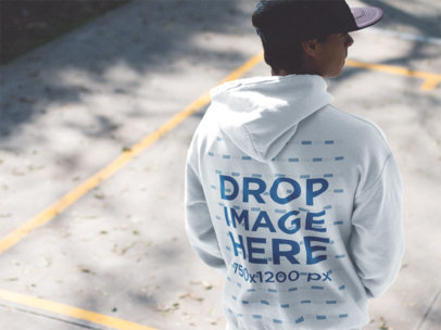 Back Side Hoodie Mockup of a Guy Wearing a Hat a12500