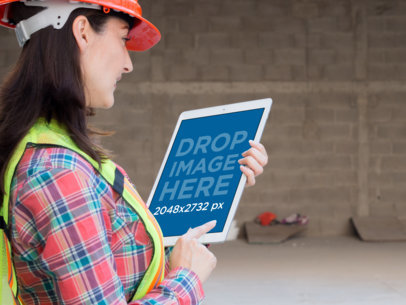 iPad Pro Mockup of a Female Architect Checking her iPad