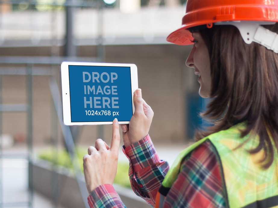 Landscape iPad Mini Mockup of a Female Architect at Work