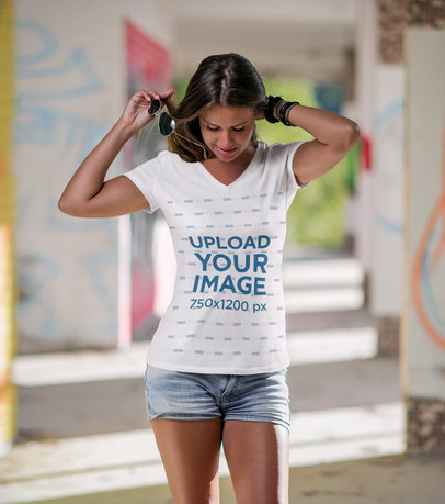 Mockup Featuring a Woman Wearing a Customizable V-Neck T-Shirt 