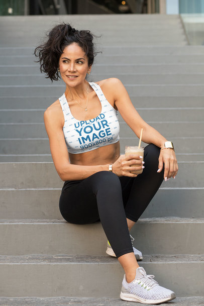 Sports Bra Mockup Featuring a Fit Woman with a Smoothie on Her Hand
