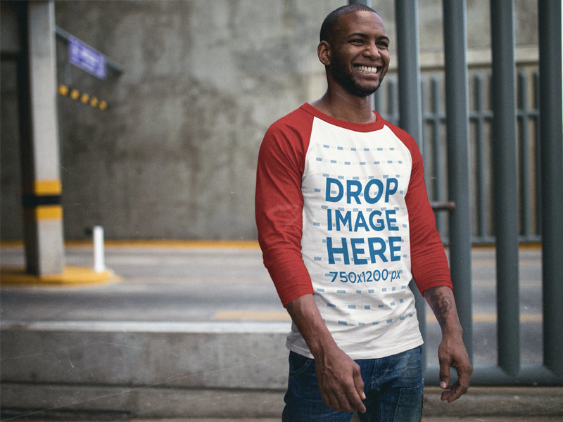 Raglan T-Shirt Mockup of a Man Smiling Over to Someone