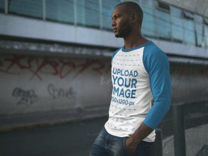 Raglan T-Shirt Mockup of a Serious Guy Standing in the Street a12551