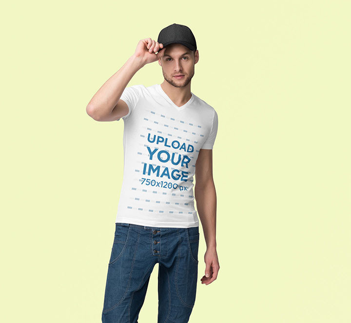 Mockup of a Man Wearing a Customizable V-Neck T-Shirt at a Studio