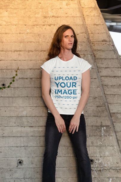 T-Shirt Mockup of a Serious Woman Leaning on a Wall